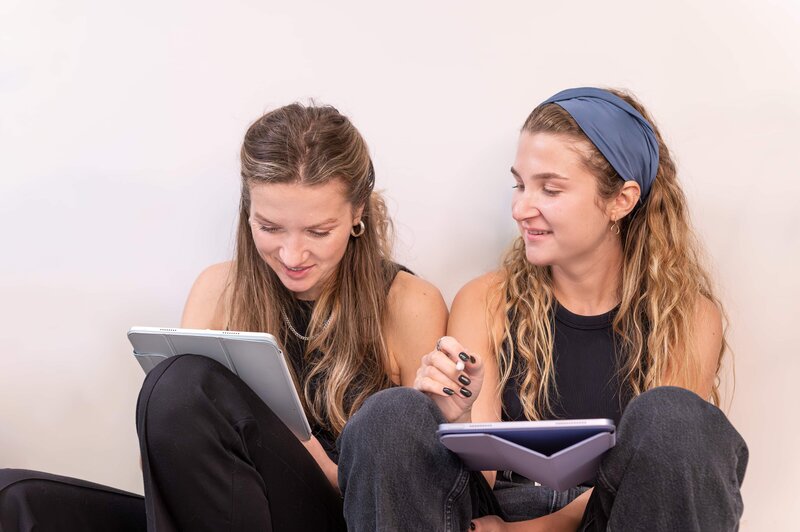 Alicia LaPierre Photography image of two sister tattoo artists sketching a tattoo