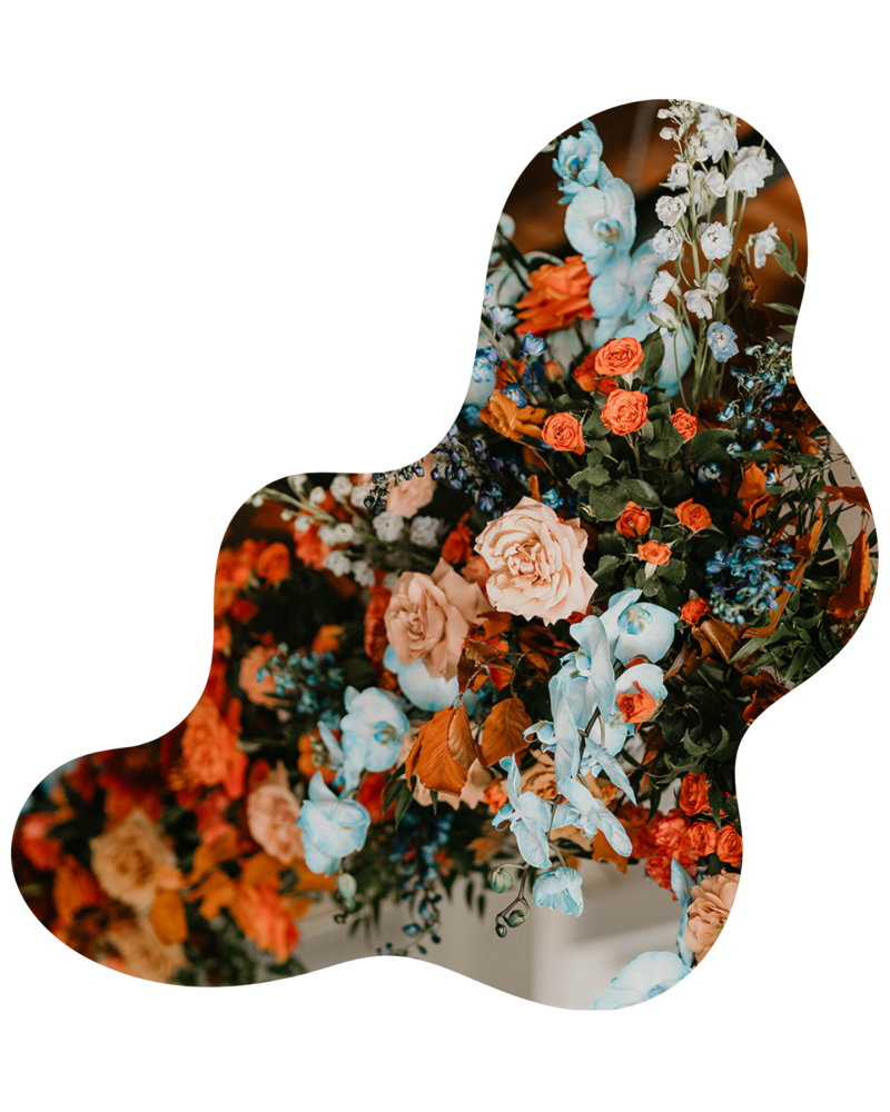 Colorful, sculptural floral arrangement created for a high-impact brand event in Dallas. Designed by The Floral Eclectic to elevate guest experience.
