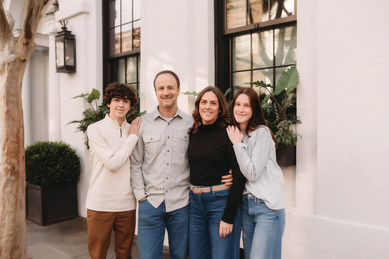 Family embraces for Family Photos in Charleston.