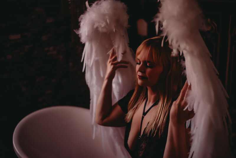 Woman in Angel wings with JoJo Photography
