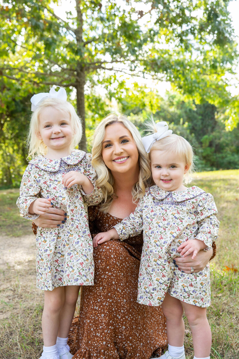 mom and two little girls in matching outfits