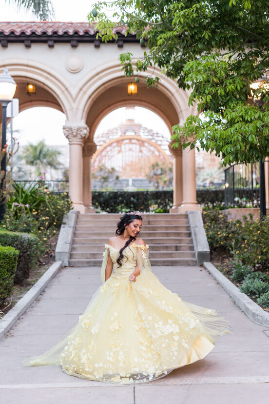 girl in yellow quinceanera dress at balboa park