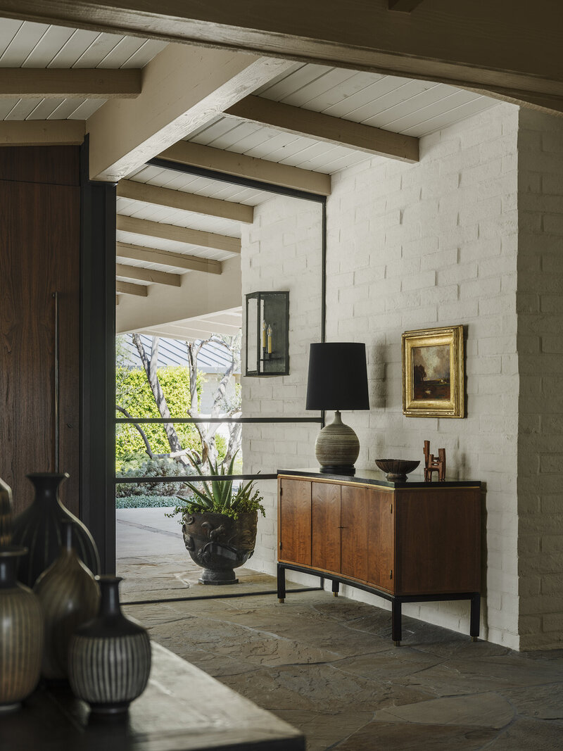 Board-formed concrete walls at front entry steps designed by Palm Springs architect