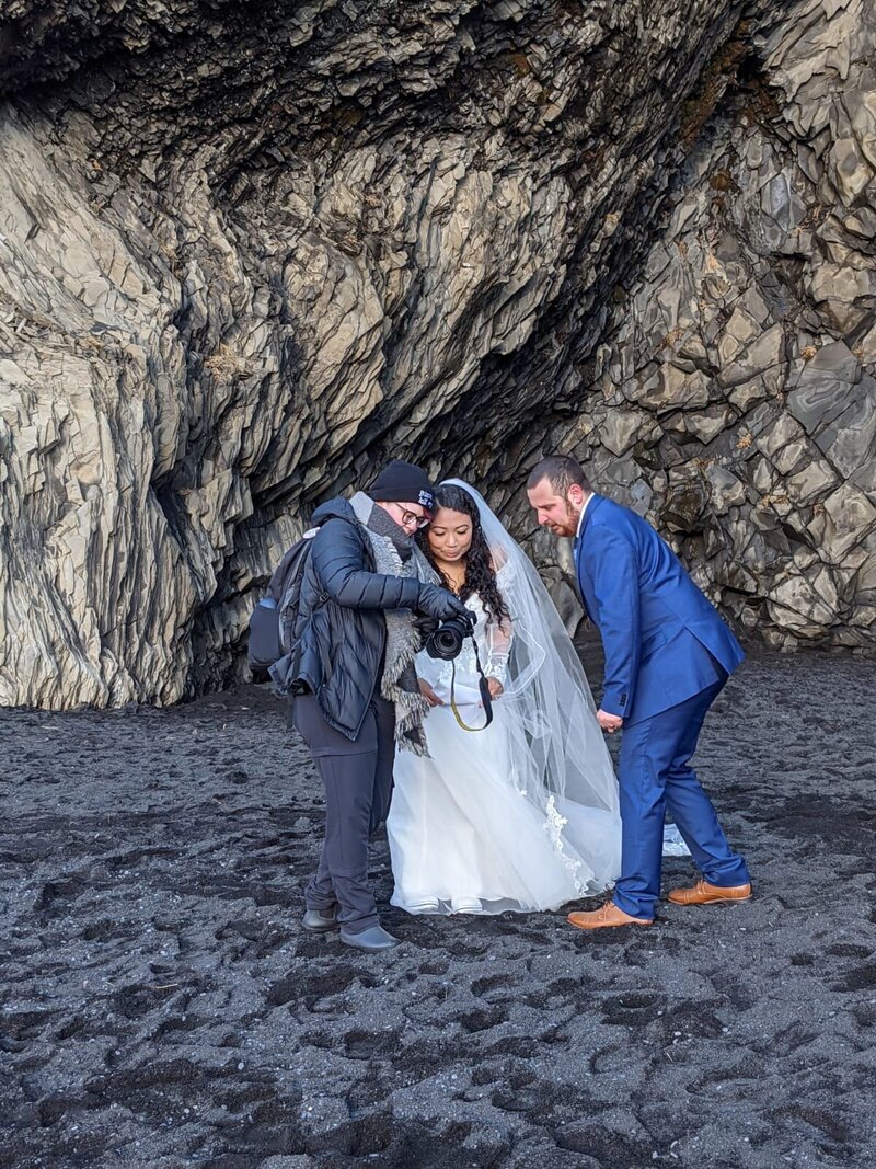 A Virginia elopement photographer shows the back of her camera to an elopement couple from Virginia who hired her to photograph their Iceland elopement.