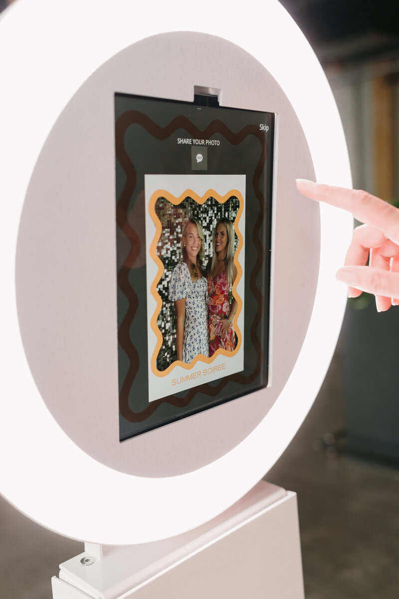 Woman sharing photo booth image to her phone