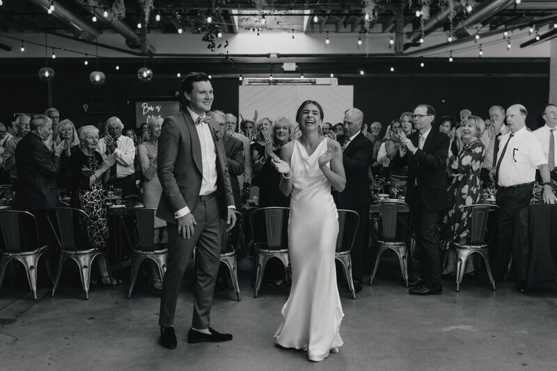 Couple during grand exit with confetti.