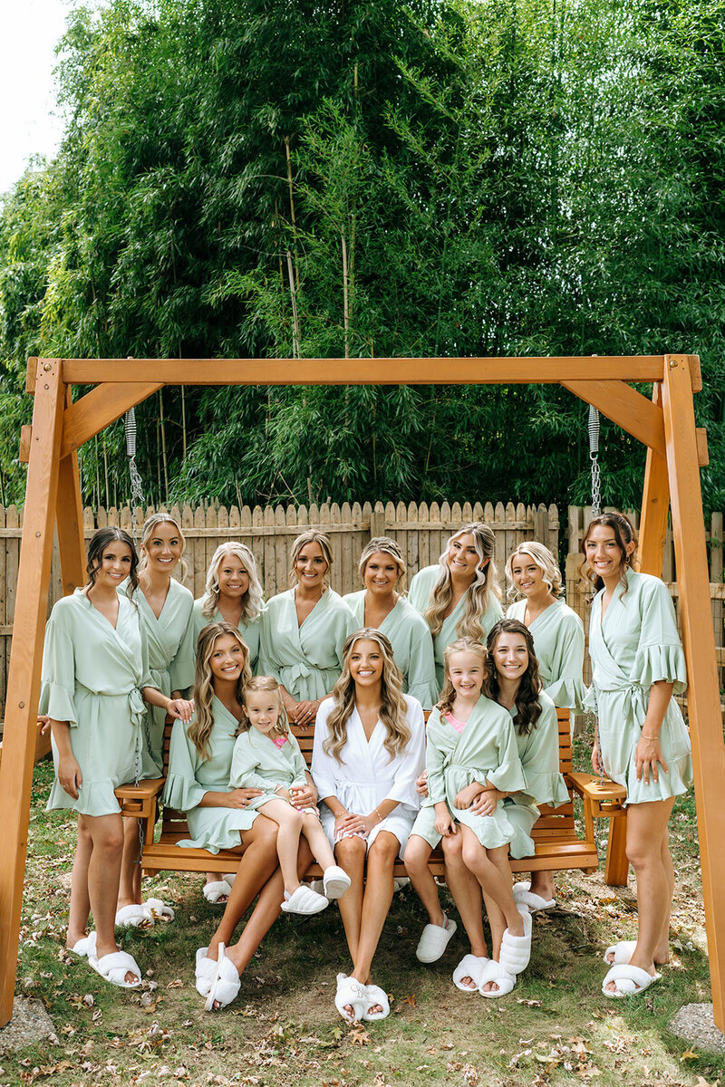 bride in robes with bridal party