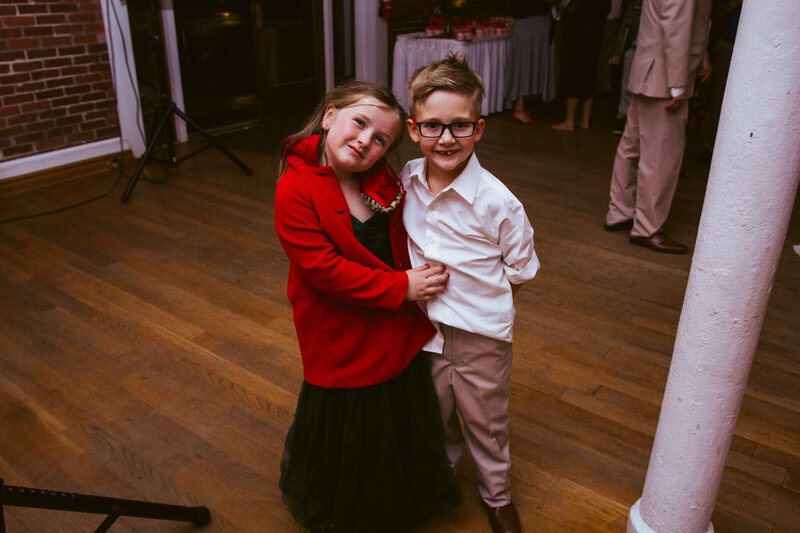 young girl and boy smiling at camera