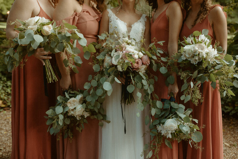 bride and bridesmaids holding bouquets