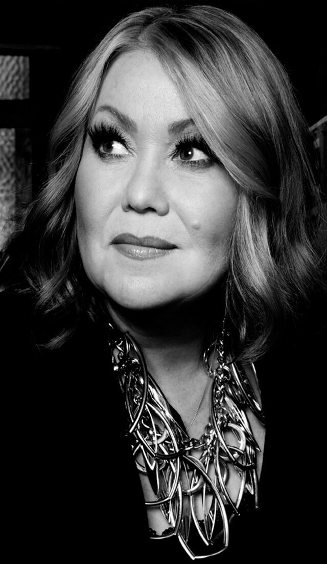 Music portrait Jann Arden close up black and white wearing large silver necklace
