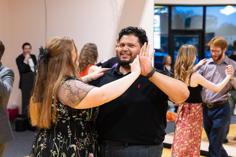 Dance students learning ballroom dancing from instructor at Dancers Studio.