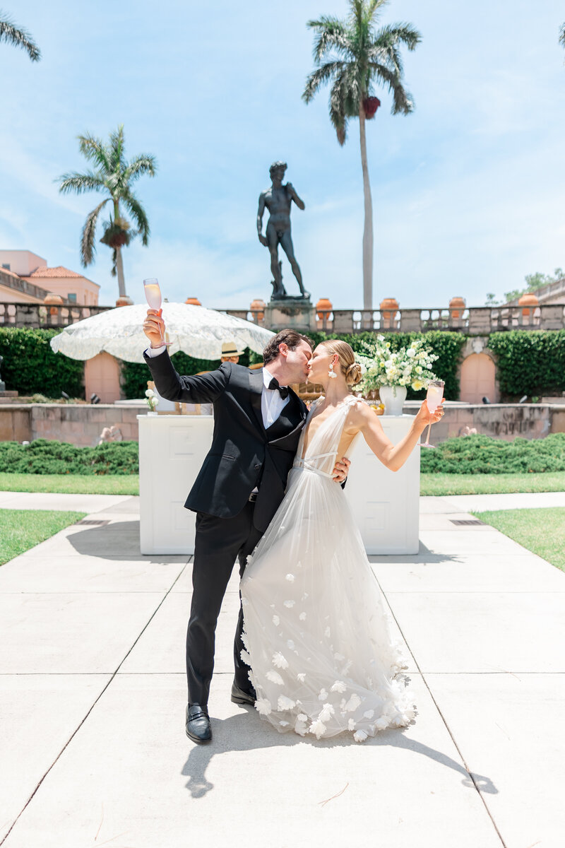 bride and groom kissing at the ringling museum by sarasota florida wedding photographer