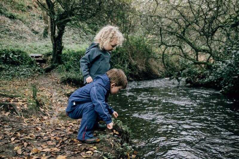 A candid family photography session in Wales capturing natural outdoor moments.