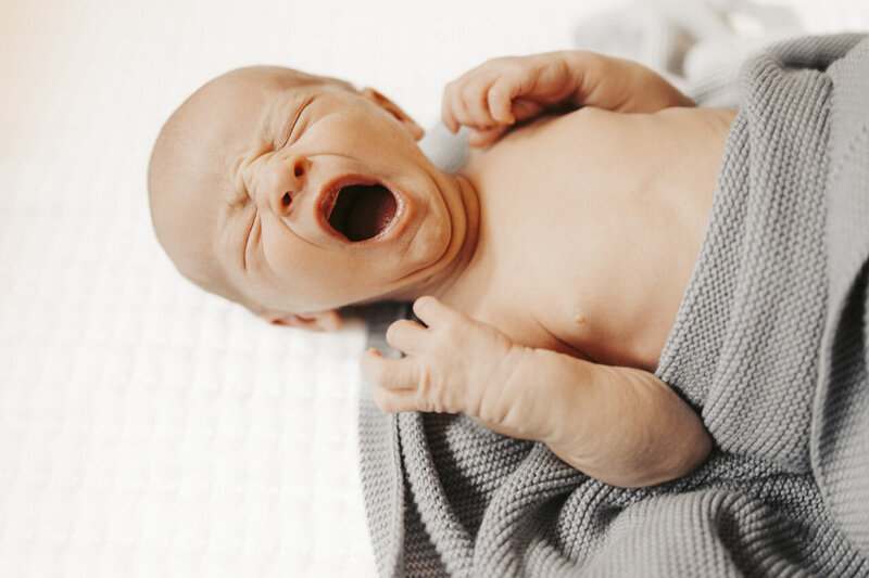 Birth and lifestyle newborn photography in Tifton Georgia: newborn yawning big