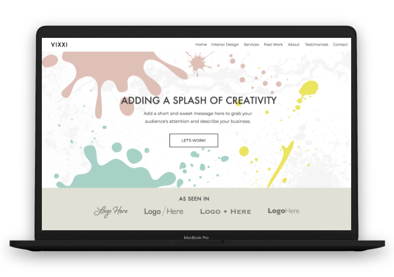 Colorful paint splatter web design on laptop