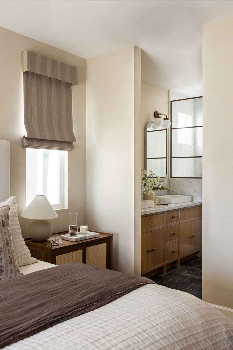 Primary bedroom with livable luxury and contemporary coastal textures
