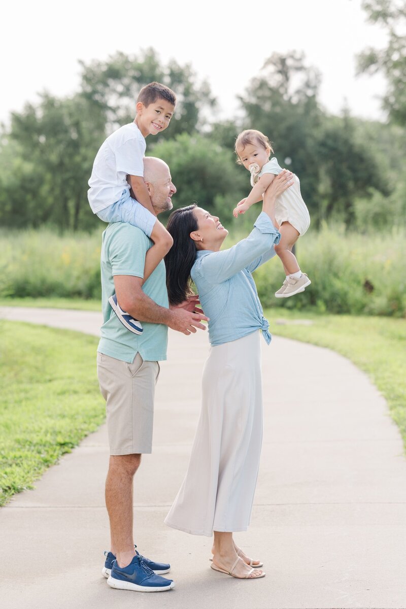 parents playing with their kids during a family photo session