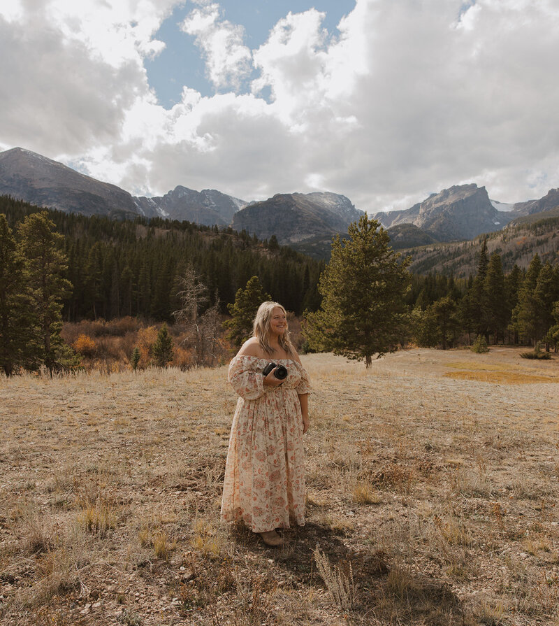 photographer holding camera gear