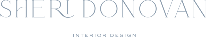 Dusty blue serif font to spell "Sheri Donovan" with "interior design" in small all caps sans serif font centered below