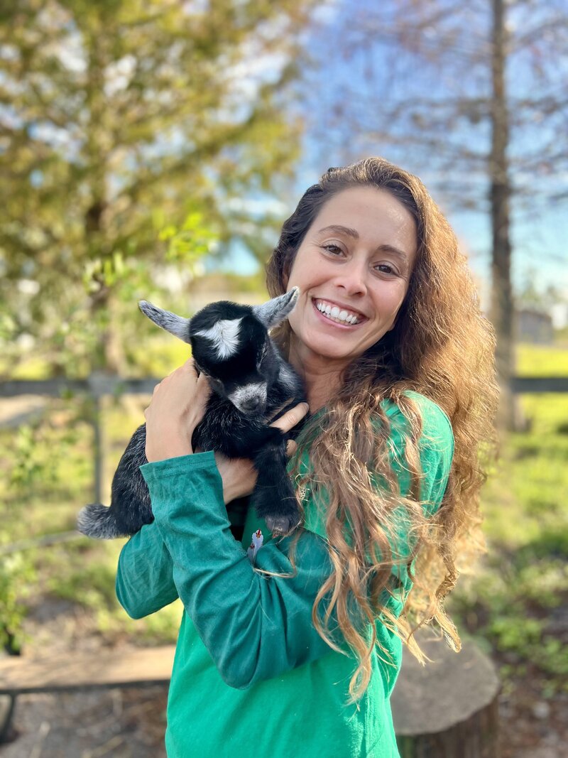 Nikki Vasconez holding a baby goat