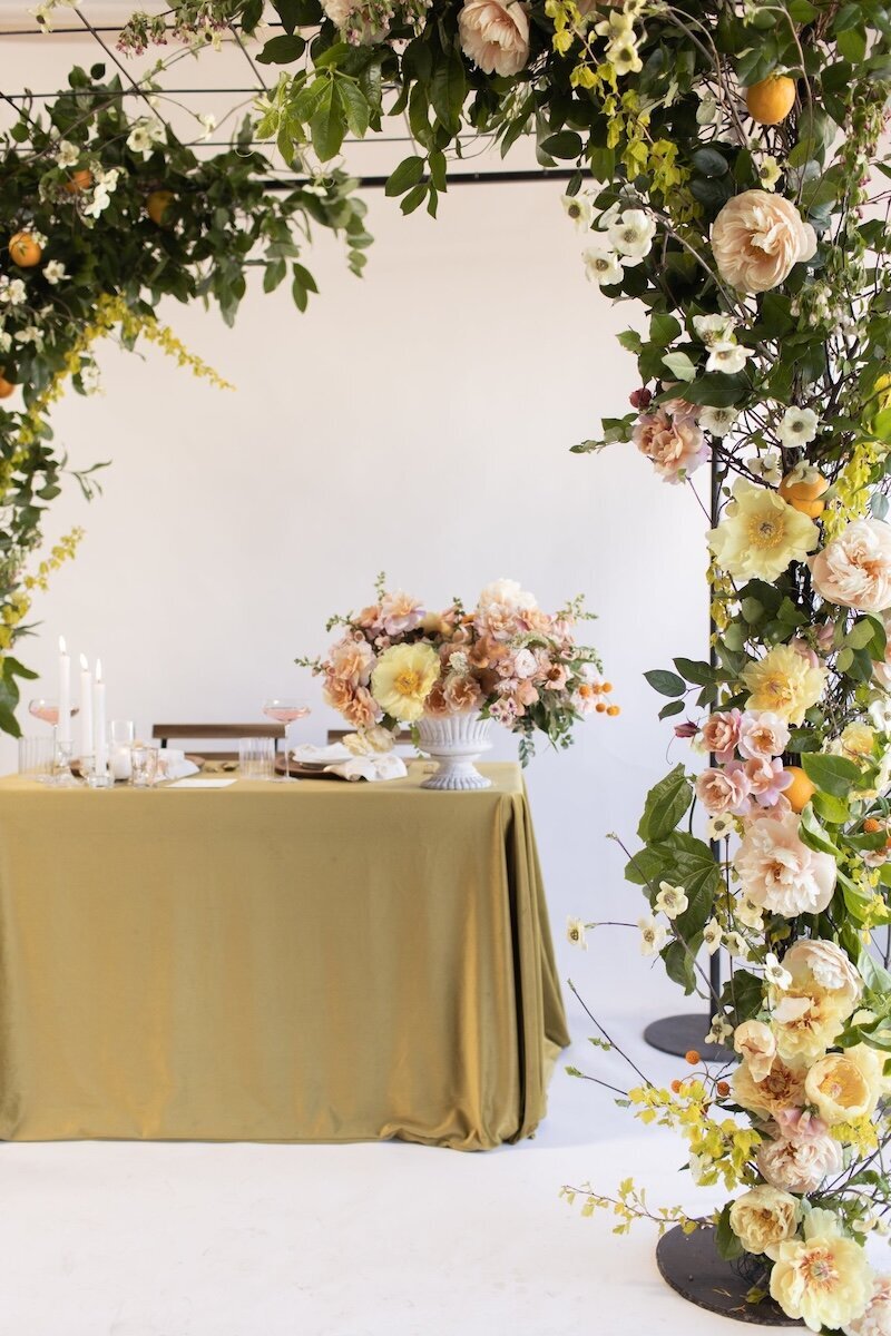 Wedding floral arch and centerpieces for a wedding in Monterey, CA