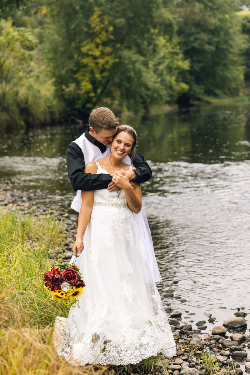 bride and groom embracing
