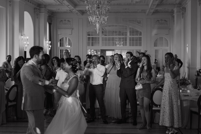 Wedding photographer captures couple taking a stroll hand in hand at their french chateau wedding.