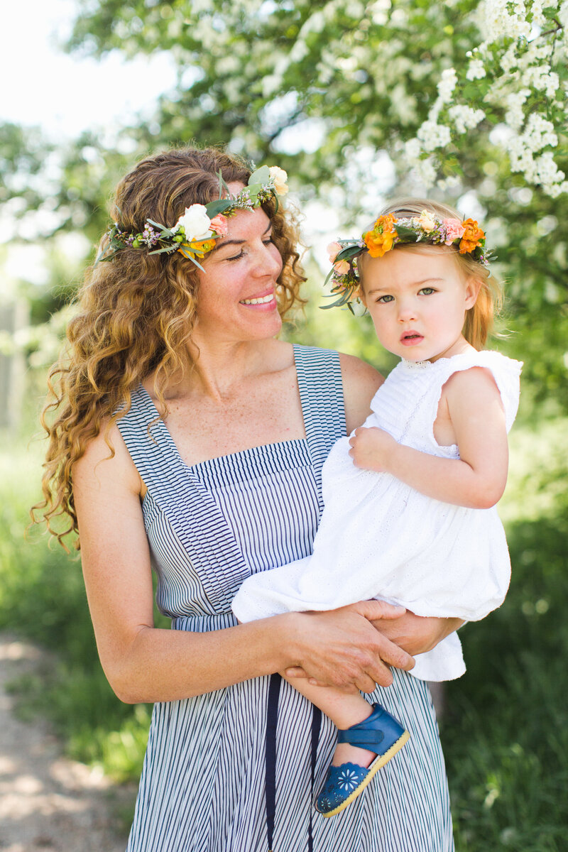 mom and son sit in a window sill during broomfield photography session
