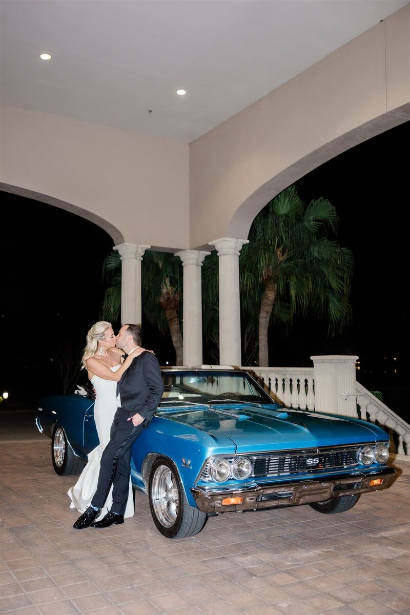 Wedding reception getaway car at the country club of Orlando by orlando wedding photographer 