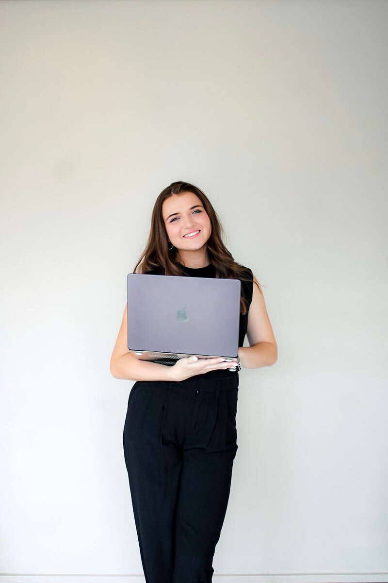 Leilah Standing with Computer