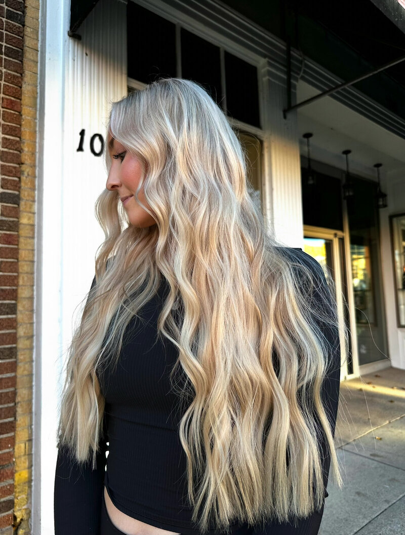 Luxury blonde extensions on client searching for the best hair extensions near Appleton WI