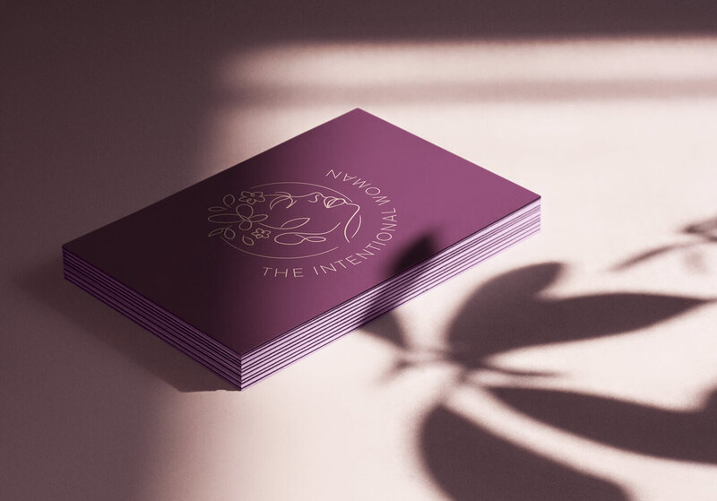 intentional woman logo design mockup on a business card
