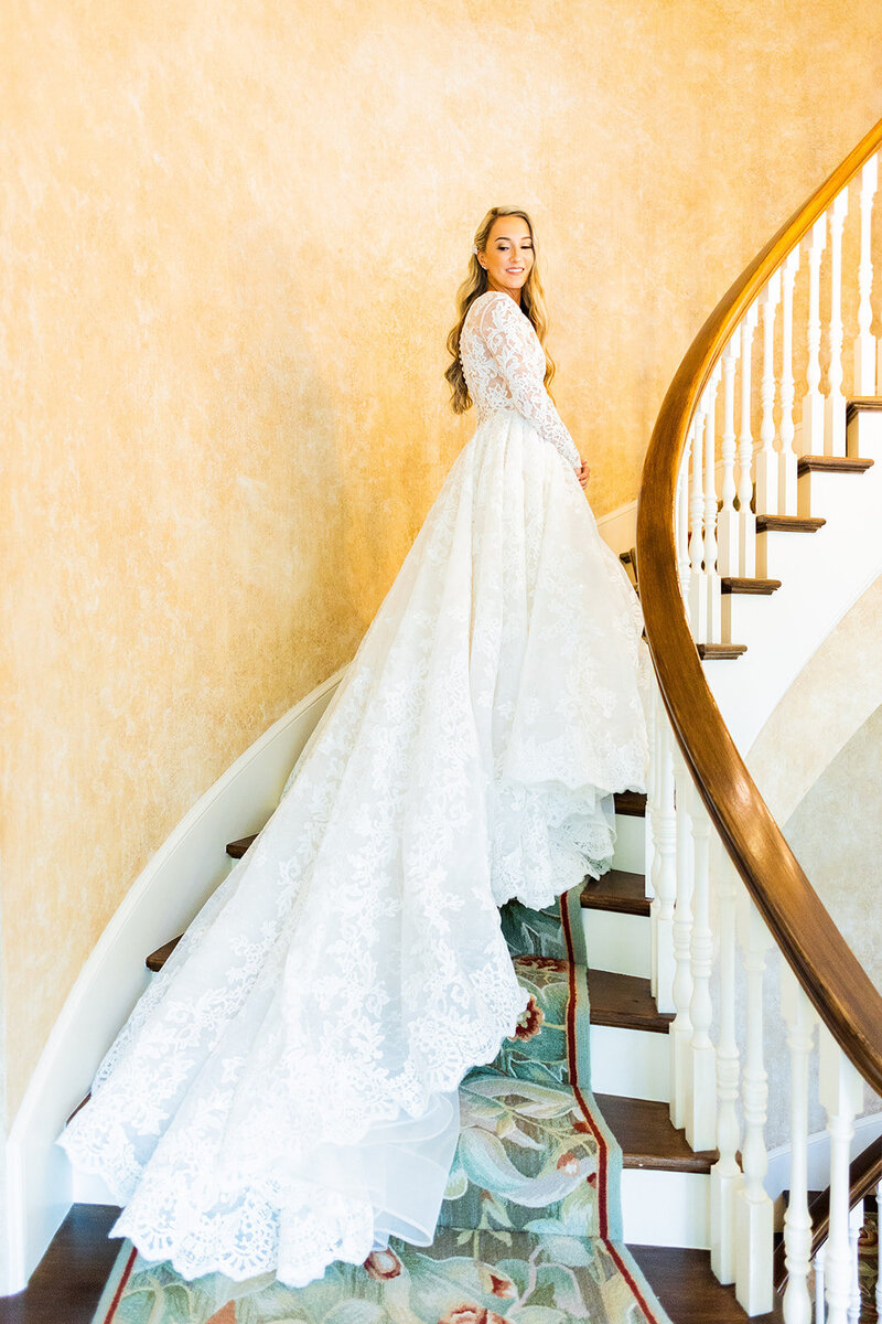 Staircase bridal portrait at luxury Alabama wedding