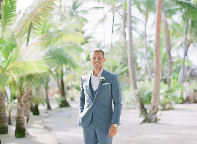 Groom portrait under the palm