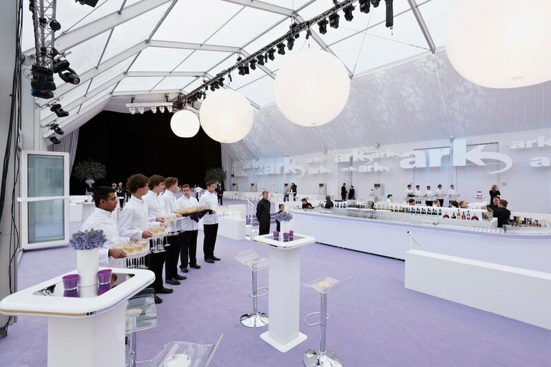 A frame marquee with a clear roof and an ice bar in the middle
