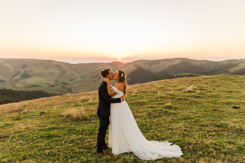 Wedding Couple on a hill at sunset