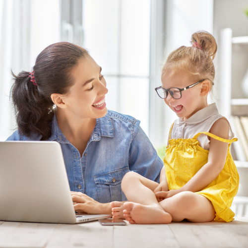 Thrive by Spectrum Pediatrics image for virtual intensive tube weaning is a child and caregiver using a laptop together for virtual services