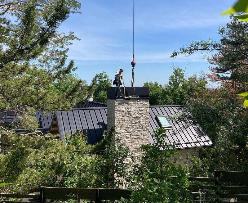 Residential and commercial chimney and roof installation by Mountainside Crane Service for Denver Metro and Foothills