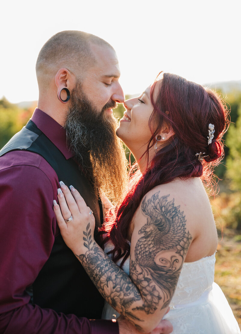 Bride and Groom nose to nose during sunset at their Fall Massachusetts Wedding