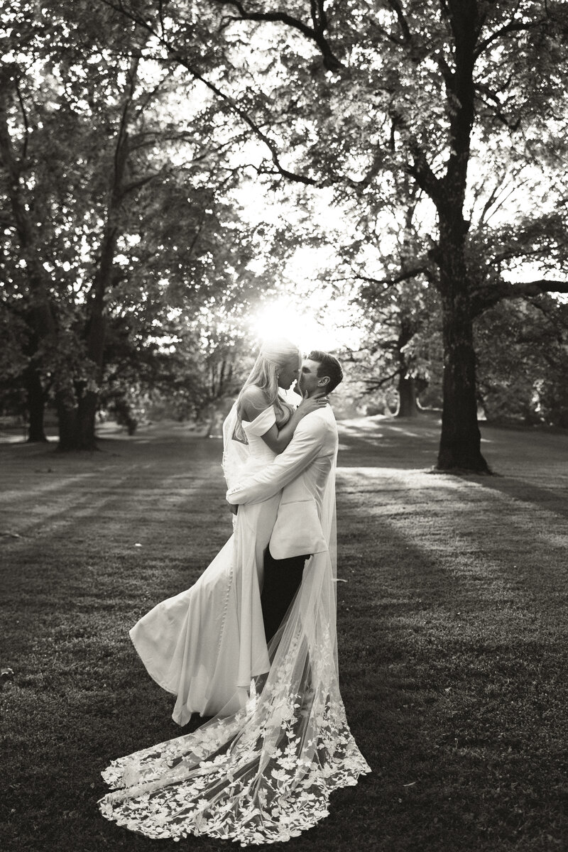 man and woman gazing at each other on their wedding day