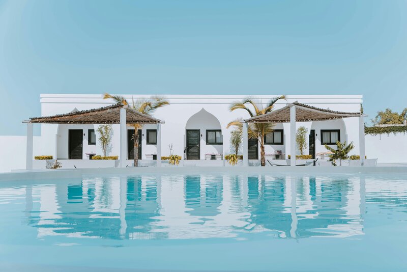 House with pool and palm trees