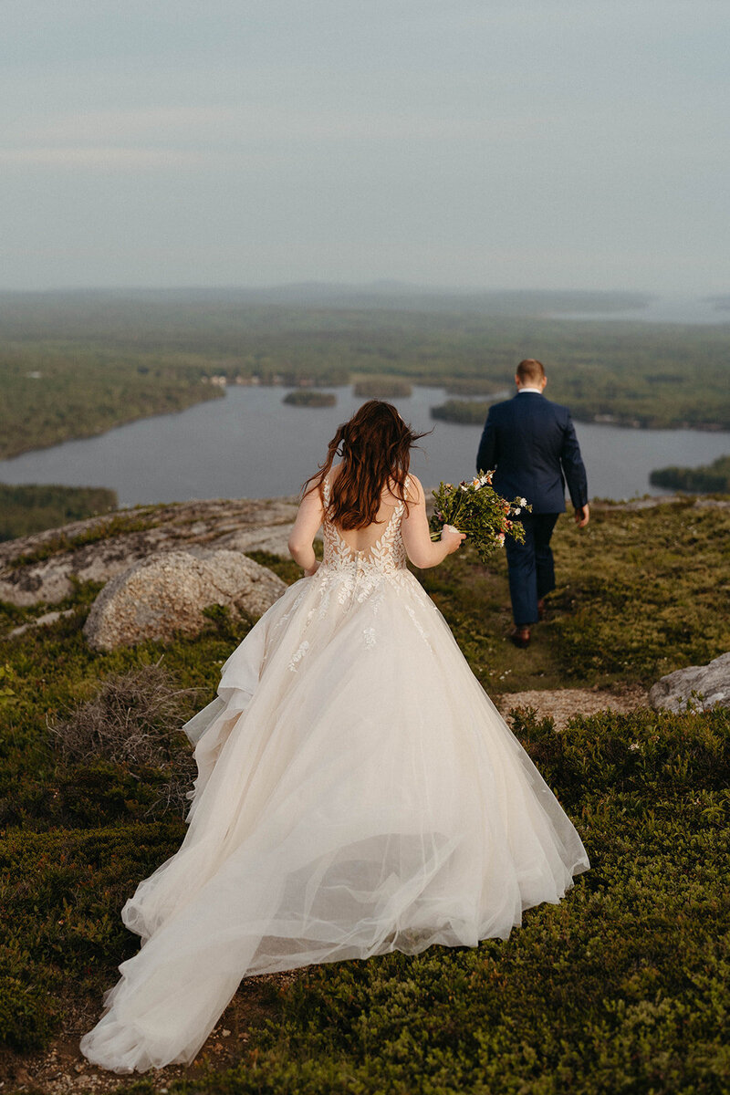 A couple reads their vows in Acadia National Park at North Bubble. Acadia elopement inspiration. Sunset vow locations in Acadia. 