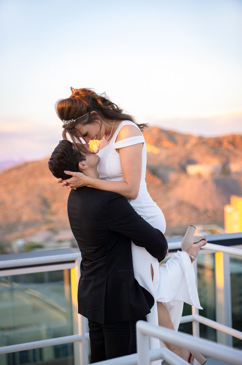 Bride & groom embracing for beautiful pose at luxury wedding in Scottsdale.
