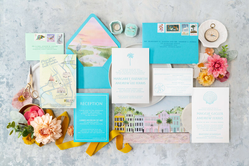 Elegant Charleston wedding invitation suite with blue and yellow accents, featuring an illustrated map and letterpress invitations