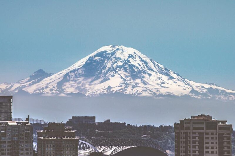 mount rainier overlooking part of the seattle skyline in washington state