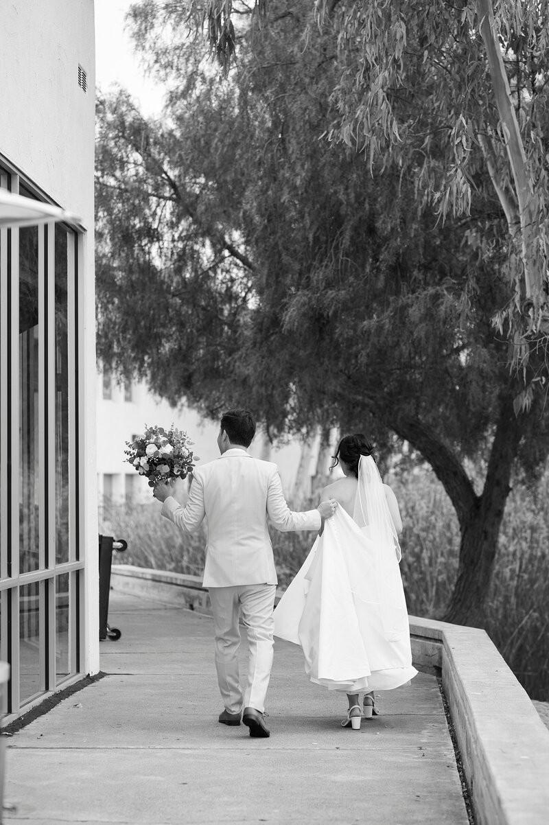 Couple taking photos after first look