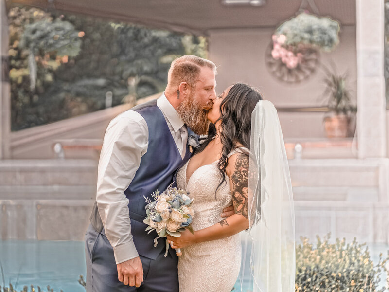 Couple portrait in front of a pool in Berkeley, CA