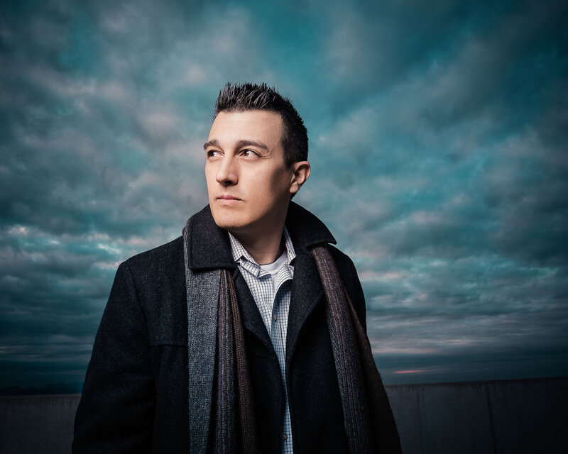 Christopher Reynolds, Austin portrait photographer, standing outside on a cold day during a creative session.