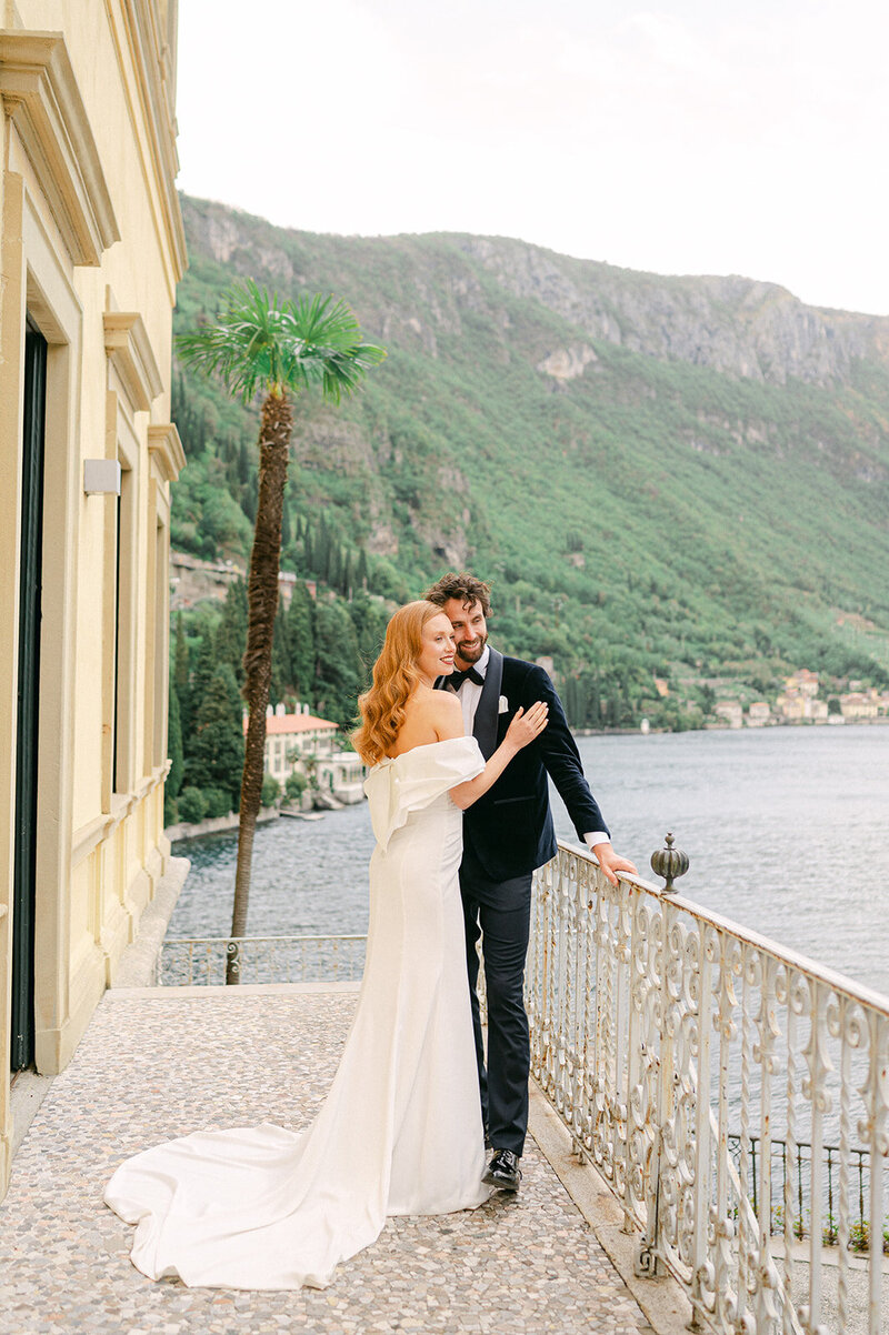 Bride and Groom look at Lake Como during their Villa Cipressi Wedding.