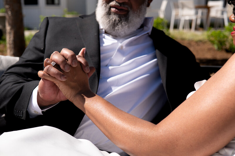 A person kneeling down and proposing to their partner 